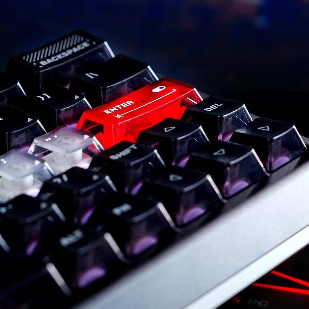 Close-up of translucent home row keycaps beside a red Enter key