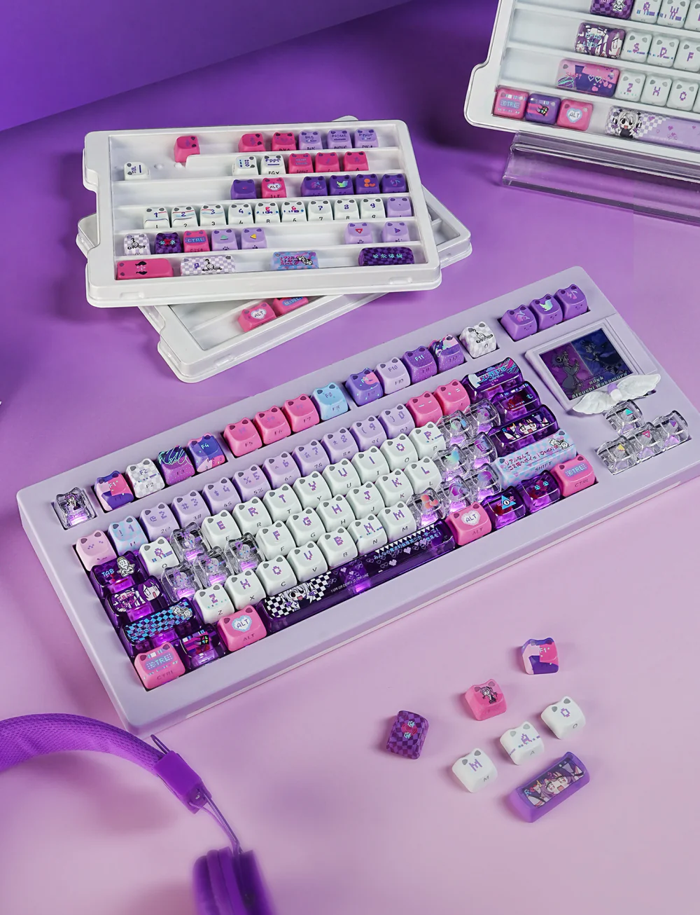 Purple, pink, white, and translucent Yunyun Denpa keycaps on a compact mechanical keyboard
