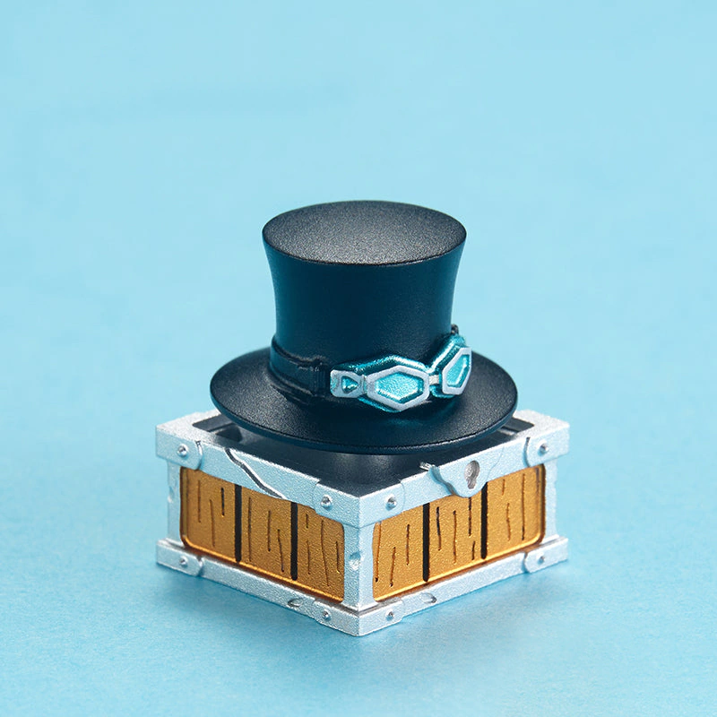 Sabo Rotating Hat Aluminum Artisan Keycap Front view of a black top hat keycap with teal goggles and a detailed base.