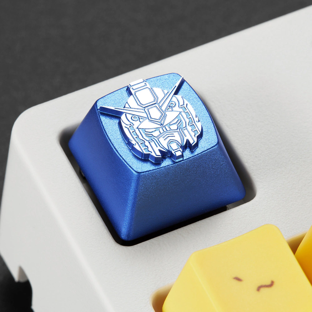 Close-up of a blue mecha head keycap set into a white keyboard.