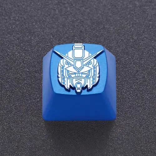 Close view of engraved linework on a blue metal mecha head keycap.