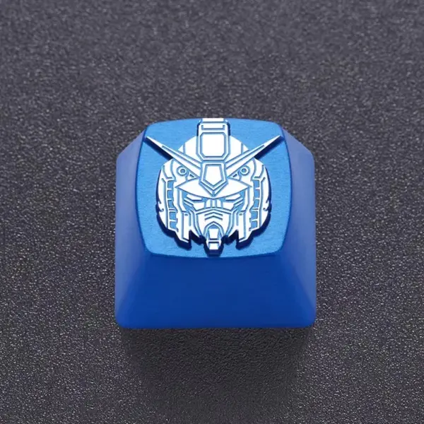 Blue Mecha Head Keycap Close View Close view of engraved linework on a blue metal mecha head keycap.