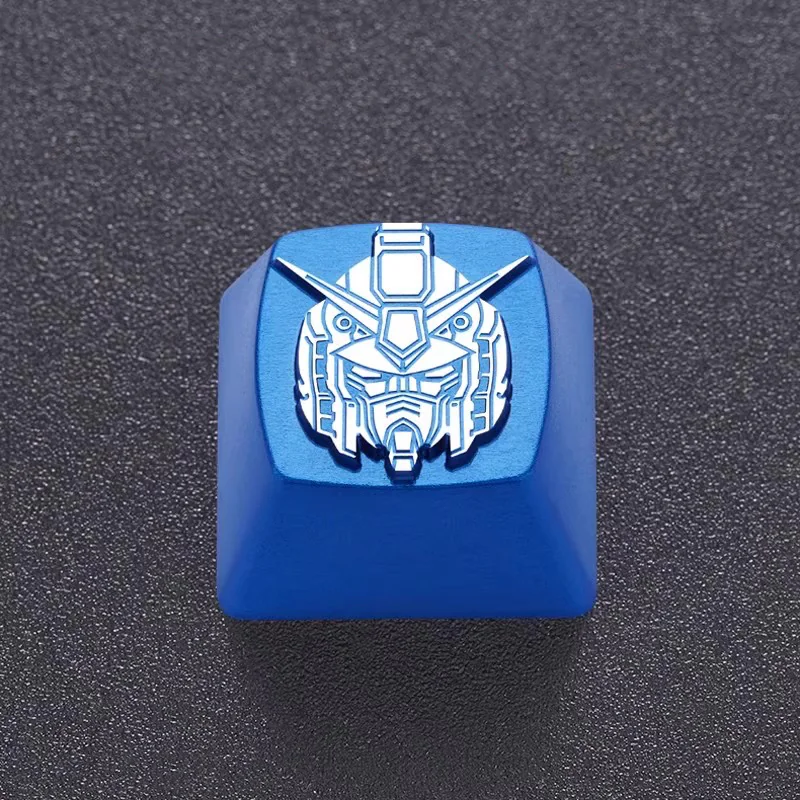 Close view of engraved linework on a blue metal mecha head keycap.