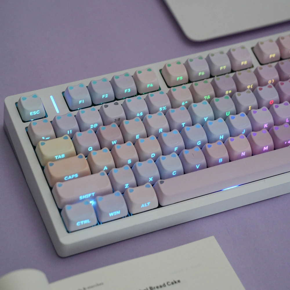 Backlit pastel MAO profile keycaps with illuminated cat-ear shapes