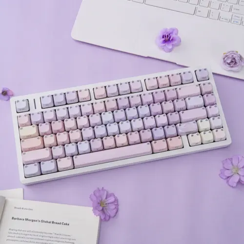 Pastel lilac and pink cat-ear MAO keycaps on a white keyboard