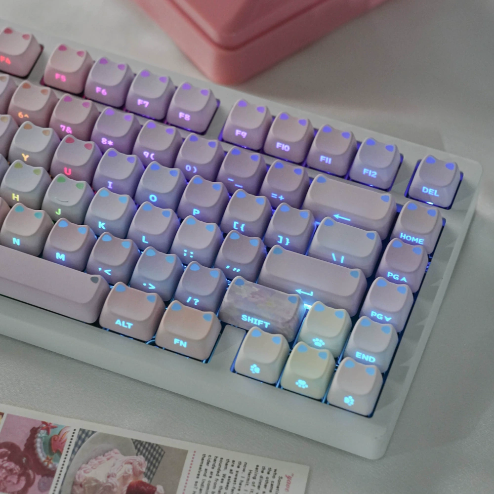Close-up of pastel MAO profile keycaps with raised cat-ear corners
