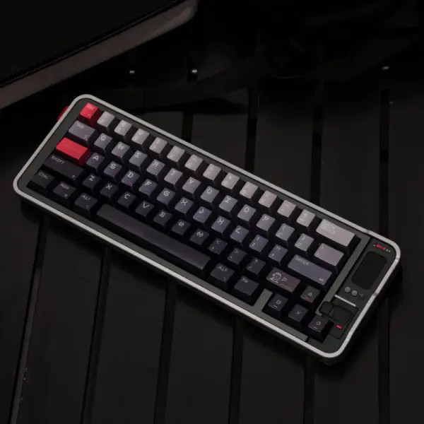 Dot Matrix Keycap Set Angled on Keyboard Angled keyboard fitted with silver-to-charcoal dot-matrix keycaps and red Esc and Shift keys.