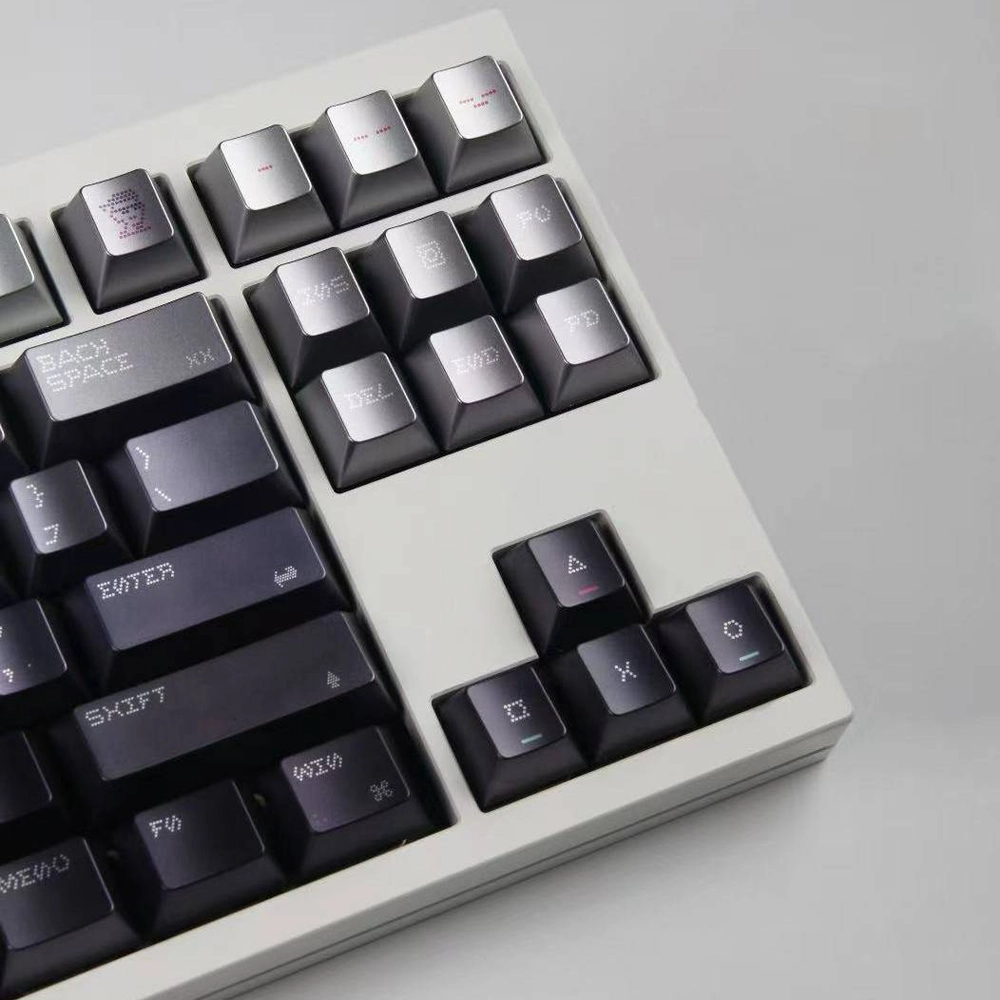 Gray dot-matrix keycaps on a dark keyboard, with red Esc and Shift keys.