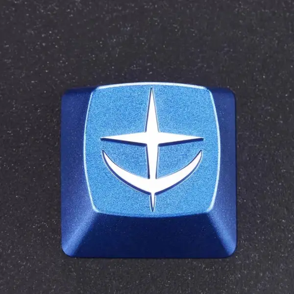 E.F.S.F. Emblem Keycap Front View Blue artisan keycap with a raised white E.F.S.F. emblem, viewed from above.