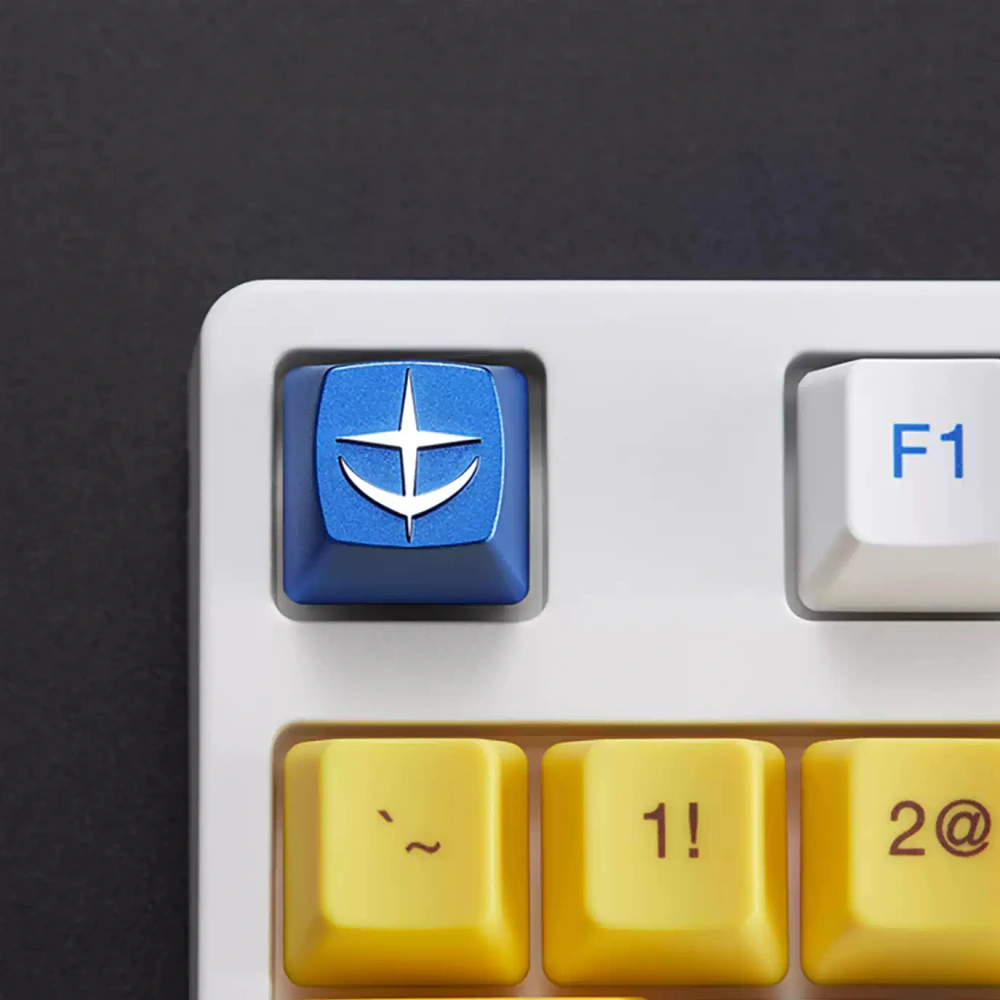 Close-up of a blue E.F.S.F. emblem keycap on a white mechanical keyboard.
