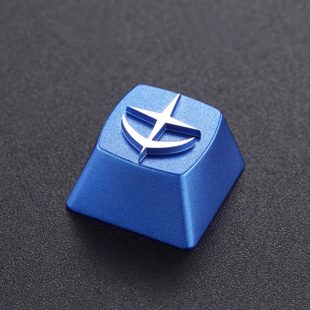 E.F.S.F. Emblem Aluminum Artisan Keycap Blue artisan keycap with a raised white E.F.S.F. emblem on a dark textured surface.
