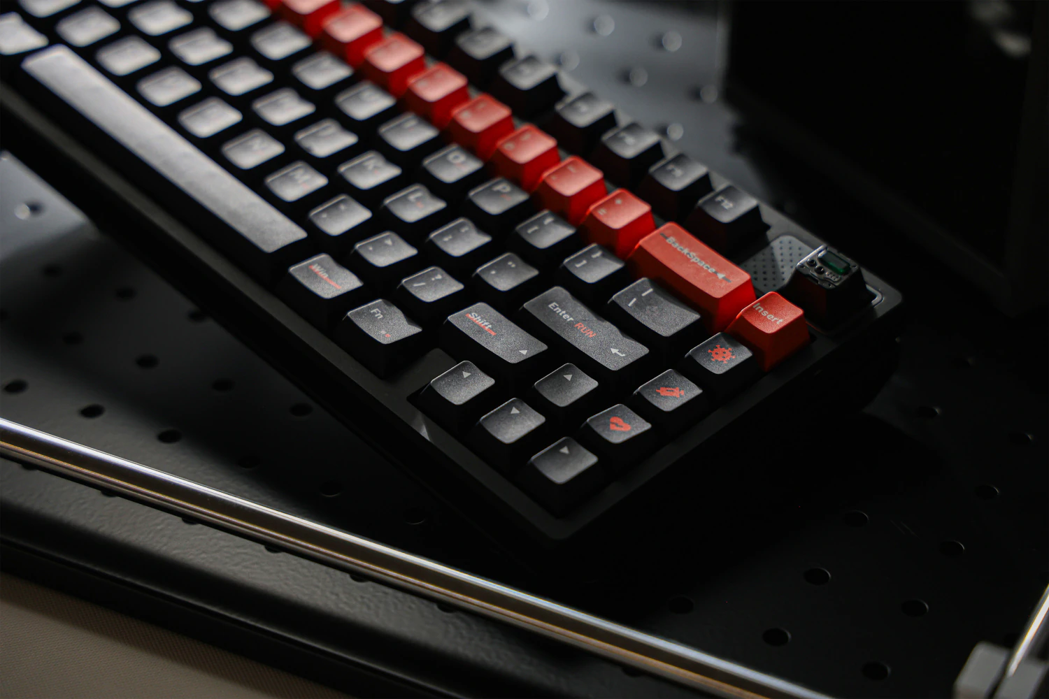Close view of orange accent keys and dark navigation keys on the keyboard.