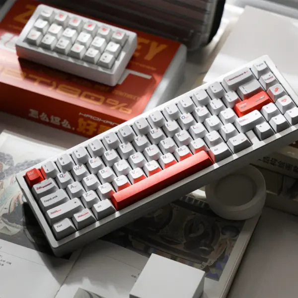 Elimination Protocol White Keyboard Cover White keyboard with orange accent keys and a gray case, photographed from above.