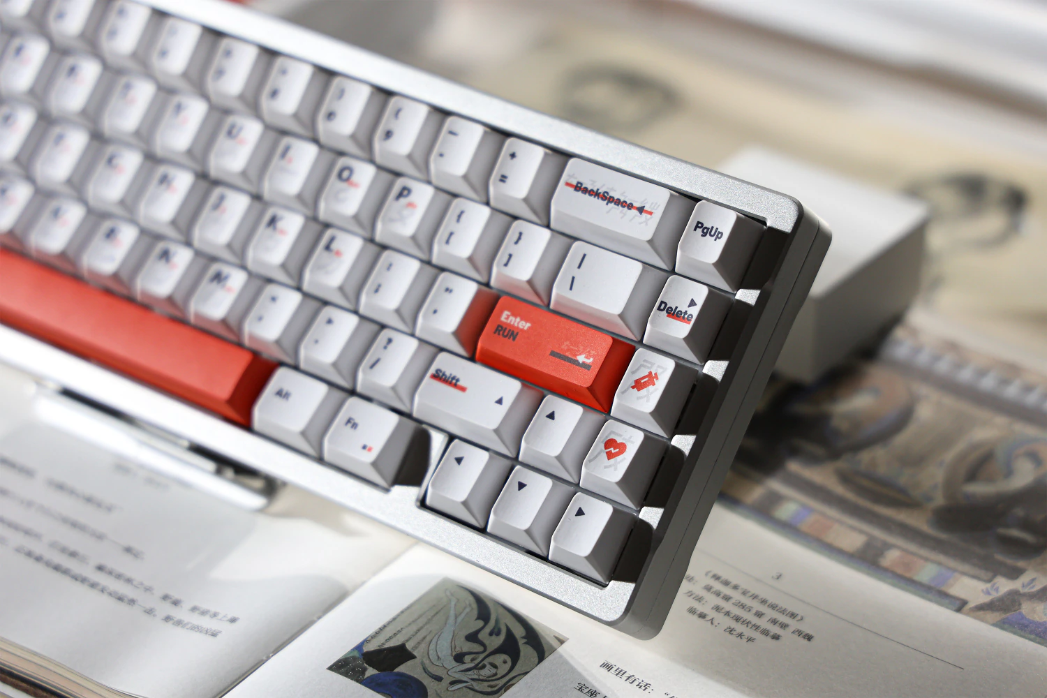 Close view of white navigation keys and orange accent keys on the keyboard.