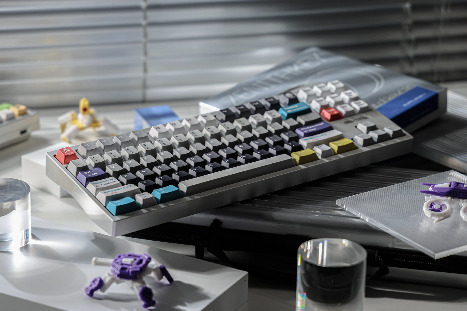 Wide scene showing the keyboard on a desk with several nearby objects.