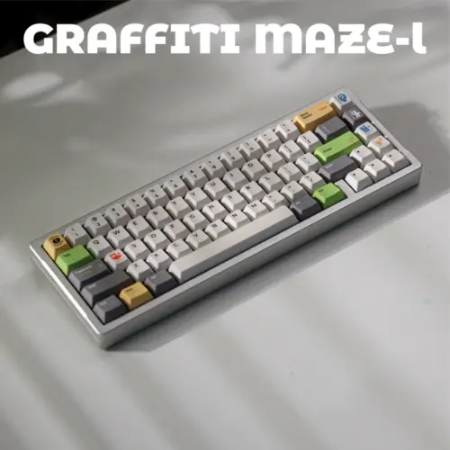 Light Graffiti Maze Cover Keyboard Angled keyboard with pale gray keys, dark gray modifiers, and green and yellow accents.