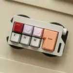Compact keyboard with red, lavender, and pink heart keycaps.