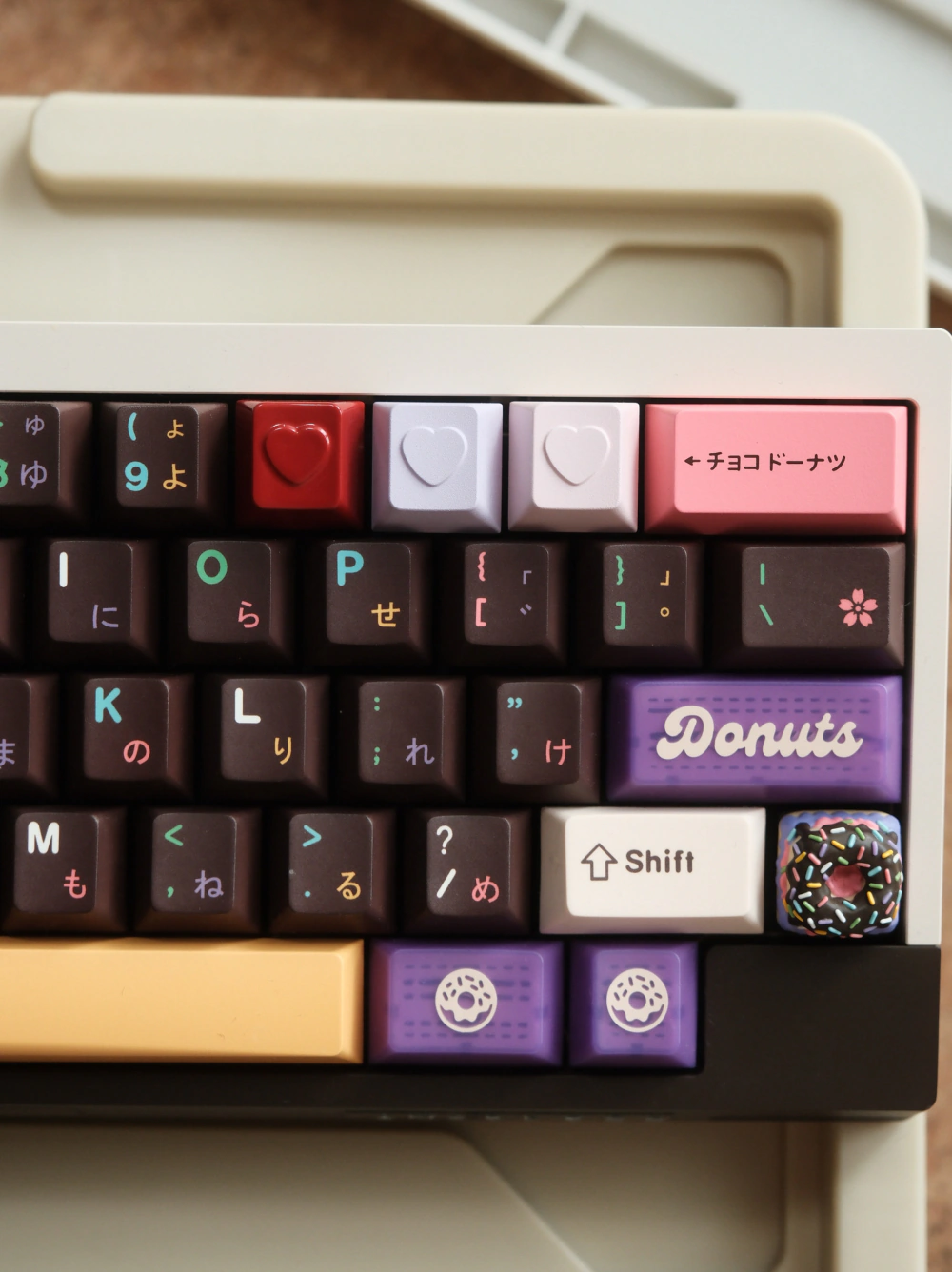 Colorful keyboard layout with three heart-shaped keycaps in the upper row.