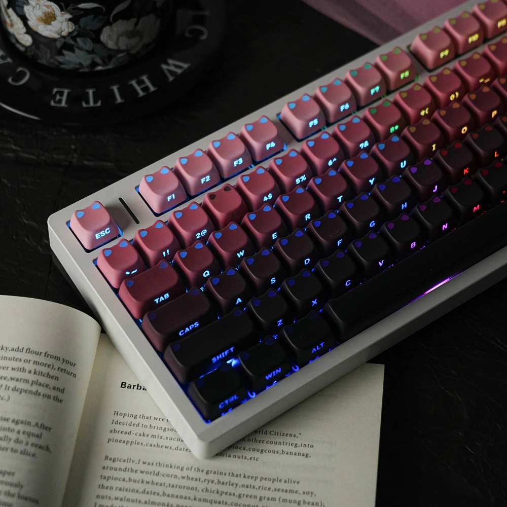 Backlit pink-to-black MAO profile keycaps with illuminated legends