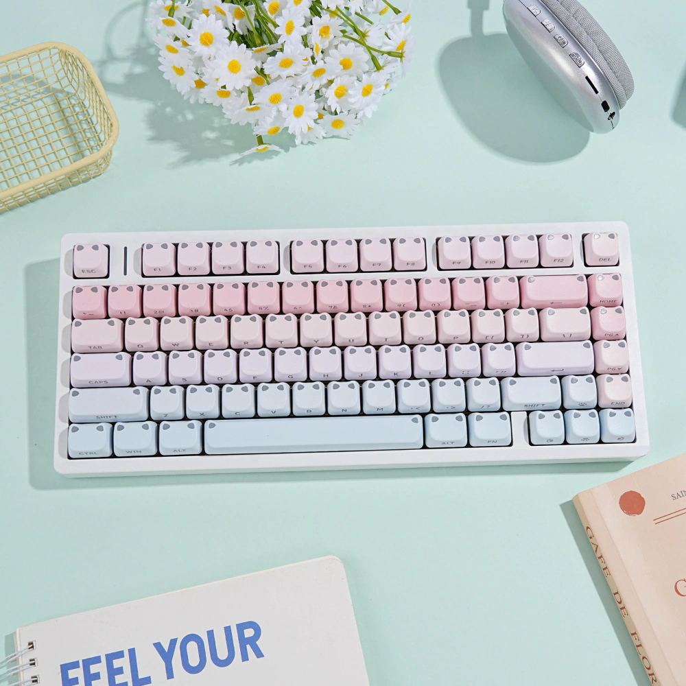 Pink-blue gradient keycaps installed on a white mechanical keyboard