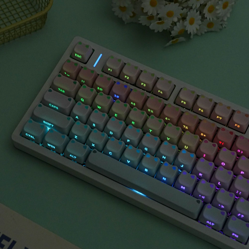 White keyboard with pink-blue gradient keycaps under multicolor RGB lighting