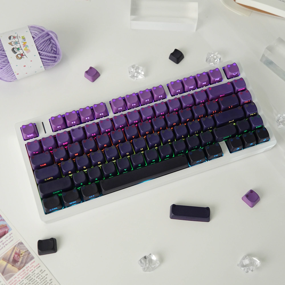 Top view of a white keyboard covered with purple-black cat-ear keycaps