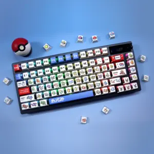 Black keyboard with white pixel keycaps, red and blue accents, and loose novelty keycaps on blue.