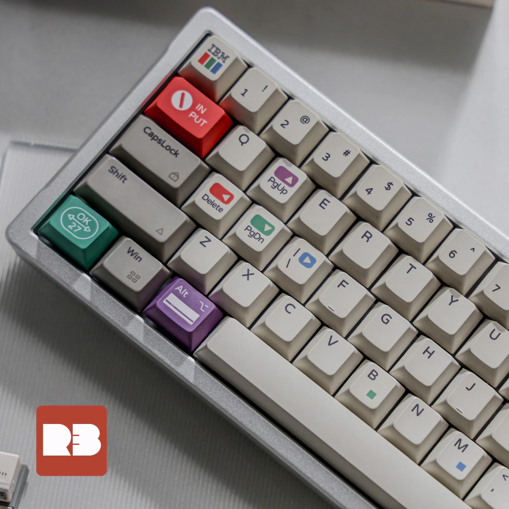 Gray and white keys surround a red Input key, a green OK key, and purple and blue accents.