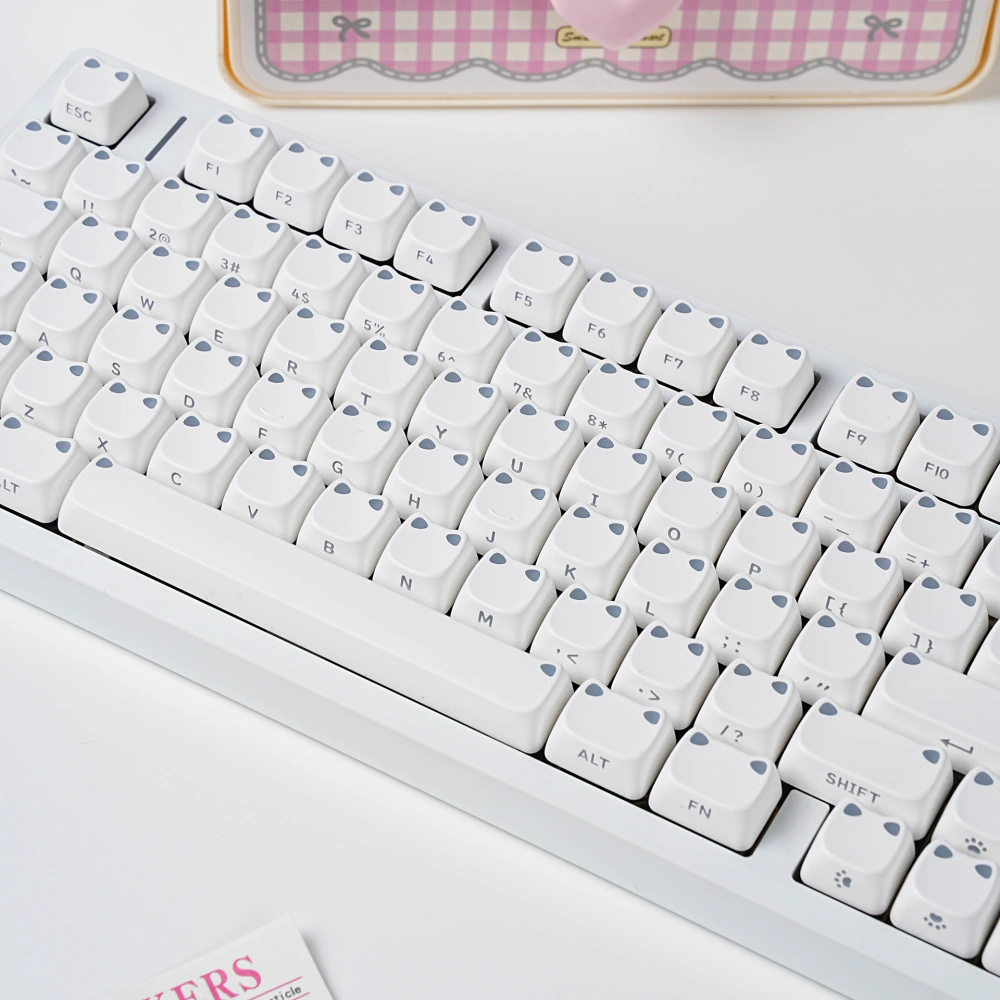 White MAO Profile Keycap Set White cat-ear MAO profile keycaps installed on a white keyboard