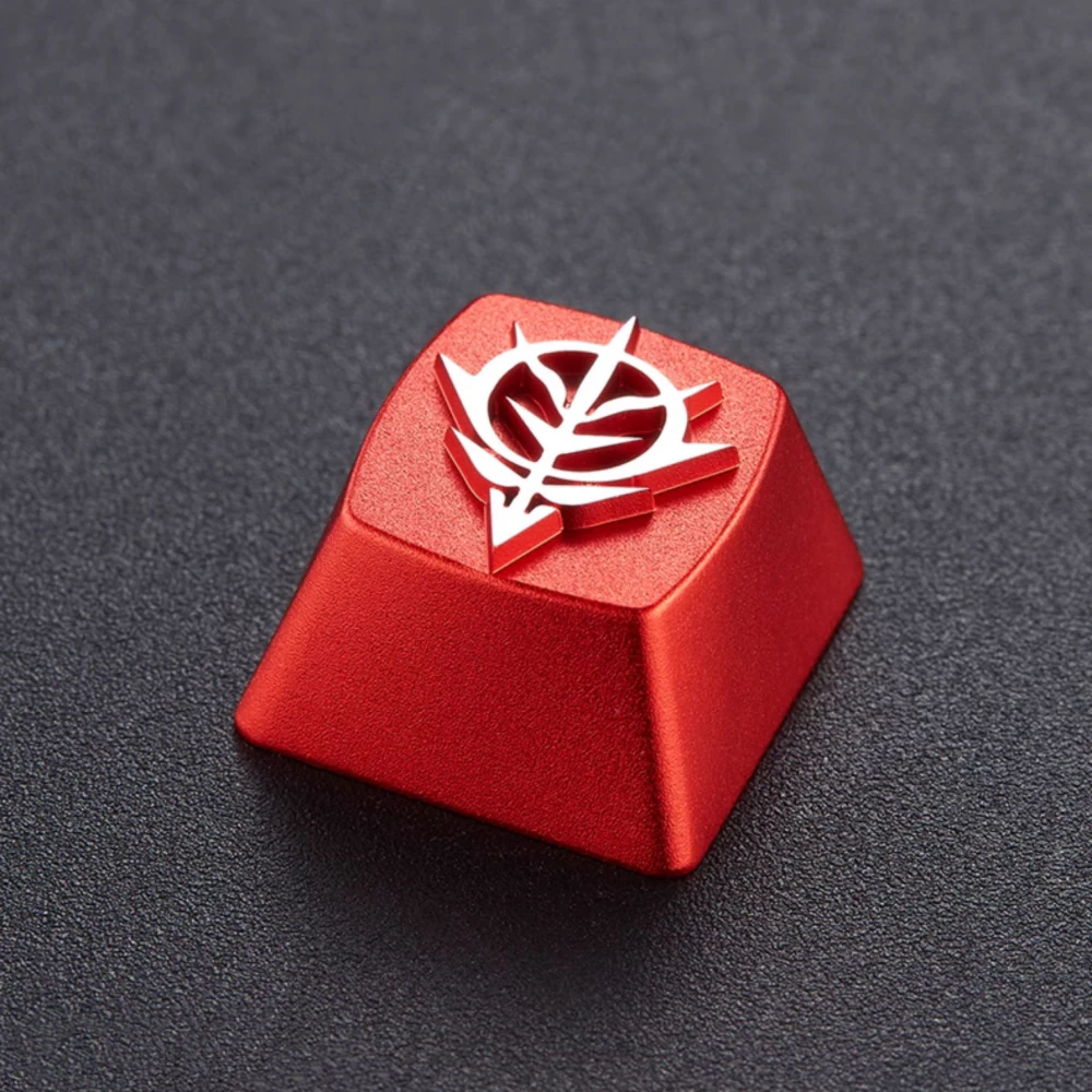Red artisan keycap with a raised white Zeon emblem viewed from an angle.