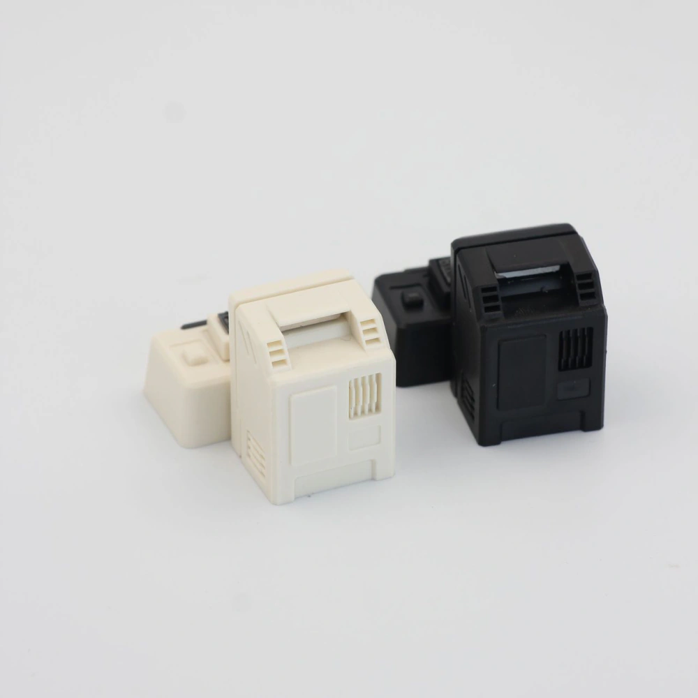 Rear view of black and cream miniature computer caps with vent details on a white background.